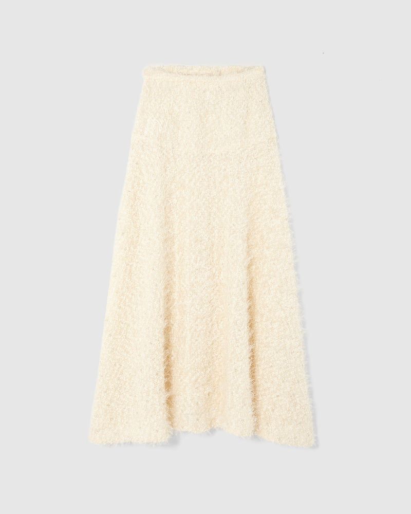 A lightweight knit skirt crafted from intricate chenille tweed, woven with plush pearl chenille and embellished with delicate silver beading. 