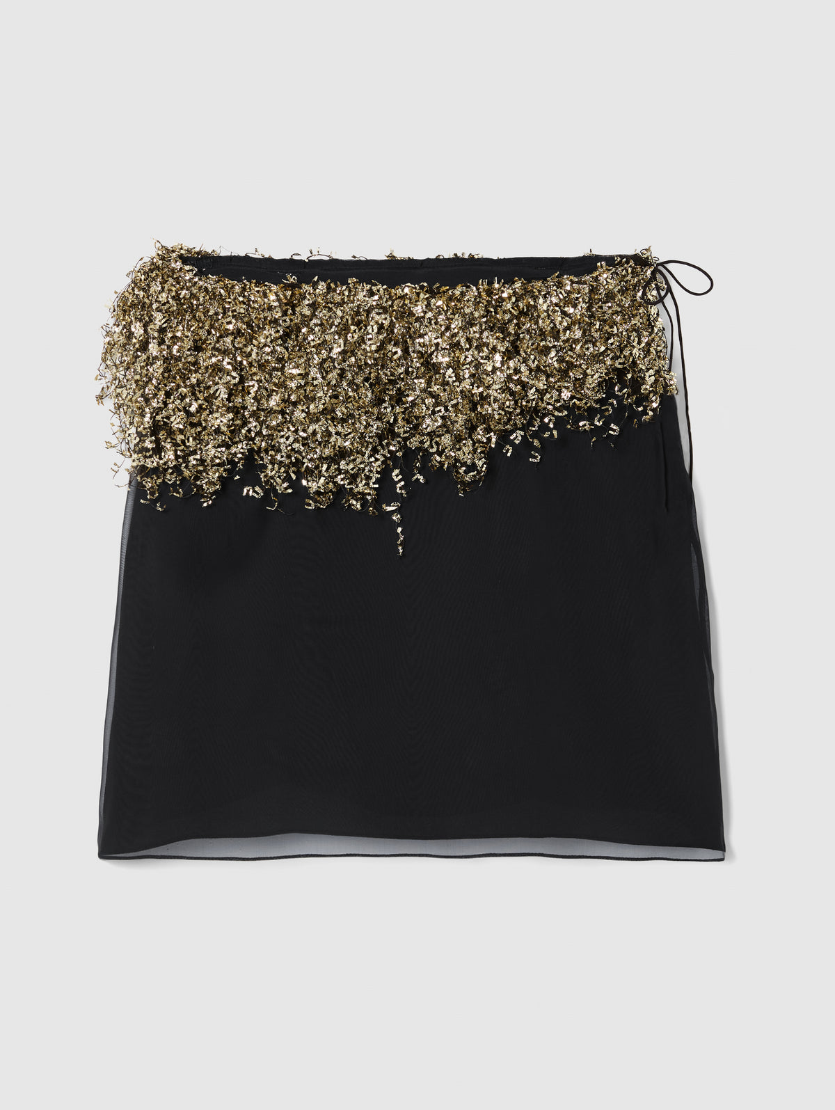 Crafted from sheer black silk, the Gold Fringe Skirt features a mini silhouette layered over a sleek slip lining, bringing effortless glamour to evening and occasion dressing.