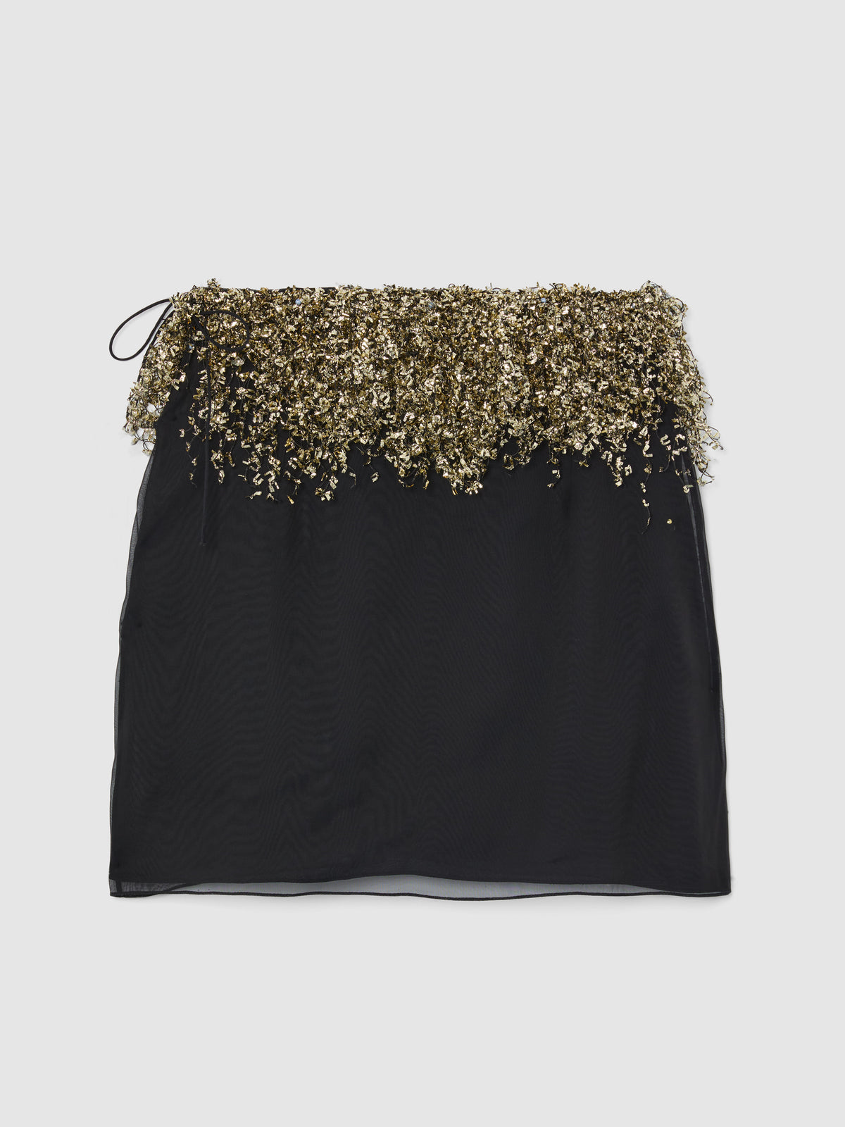 Crafted from sheer black silk, the Gold Fringe Skirt features a mini silhouette layered over a sleek slip lining, bringing effortless glamour to evening and occasion dressing.