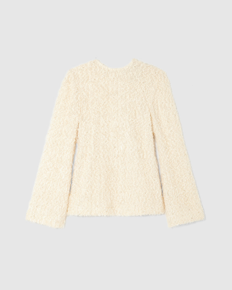 A lightweight knit top crafted from intricate chenille tweed, woven with plush pearl chenille and embellished with delicate silver beading. 