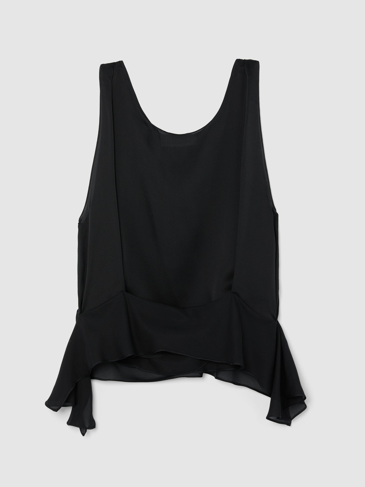 Crafted from fluid black silk, this sleeveless top features a softly draped bodice and elegant scoop neckline, creating a graceful, feminine silhouette.